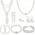 Pearl jewelry set with layered necklace, hoop earrings, drop earrings, bracelet and studs.